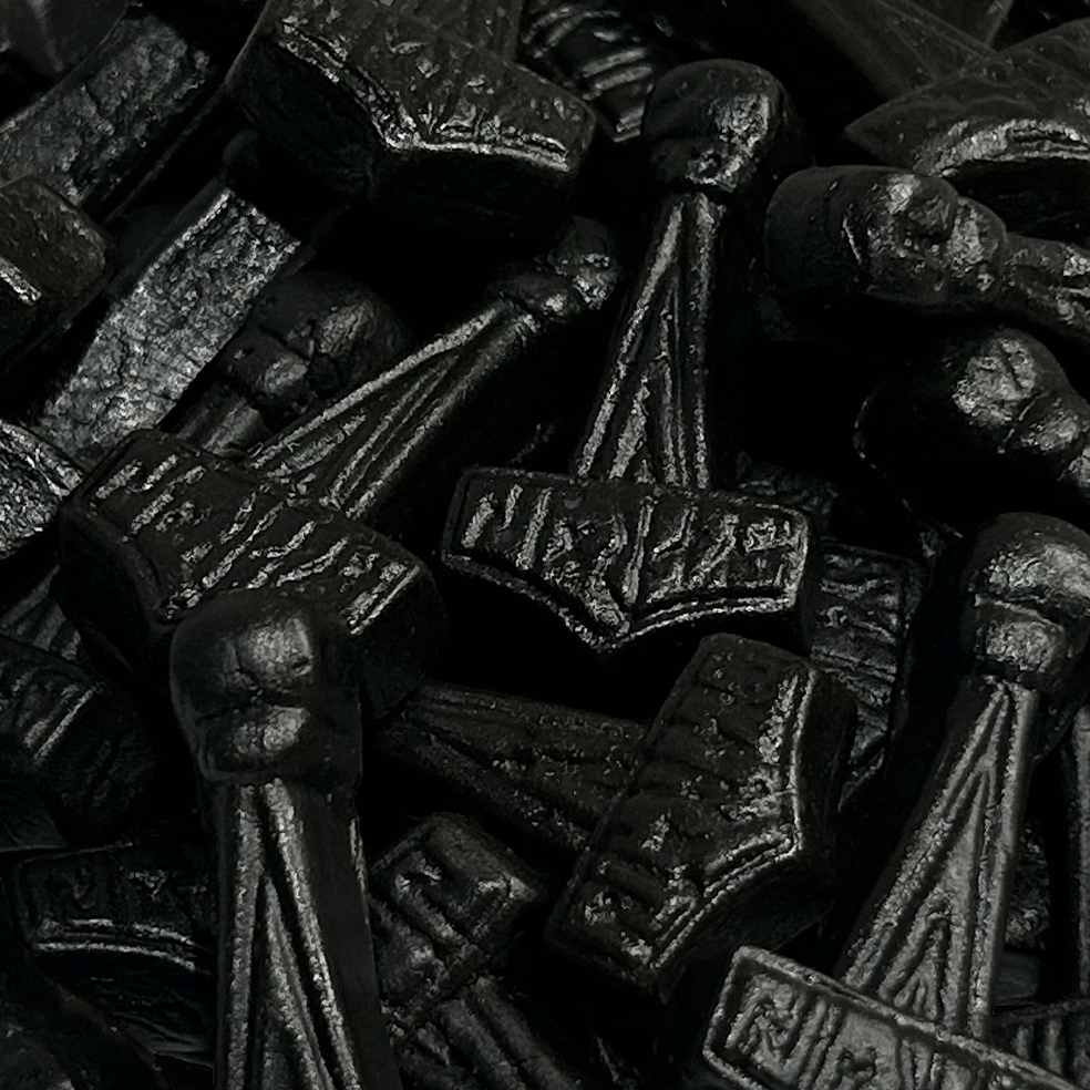 Close-up of salty Mjolnir candies showing the product's texture and hammer shape in detail