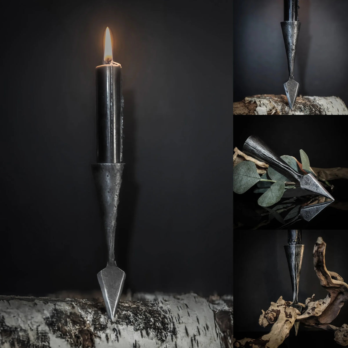 Gugnir ljusstake av handsmide jarn i spjarformad design med tent ljus, fotograferad mot dark bakgrund med atmosfariska detaljer som visar forgjord finish och viking-inspirerad formgivning