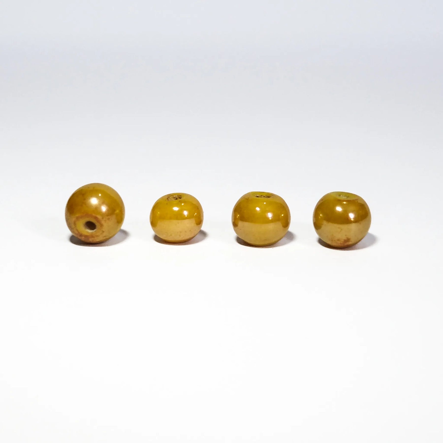 Guldtoniga runda glaspärlor, 6mm