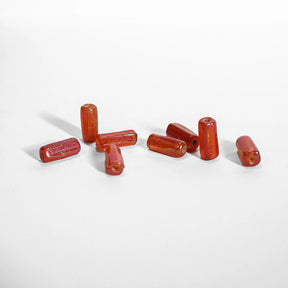Orange glaspärla - elongated glass beads in translucent orange-red, approximately 1.5cm length, suitable for jewelry making and beading projects
