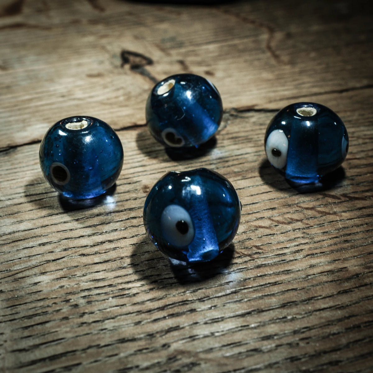 Blue round glass bead from Birka, glossy