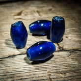Deep blue bead in transparent glass, glossy – replica of a find on Gotland