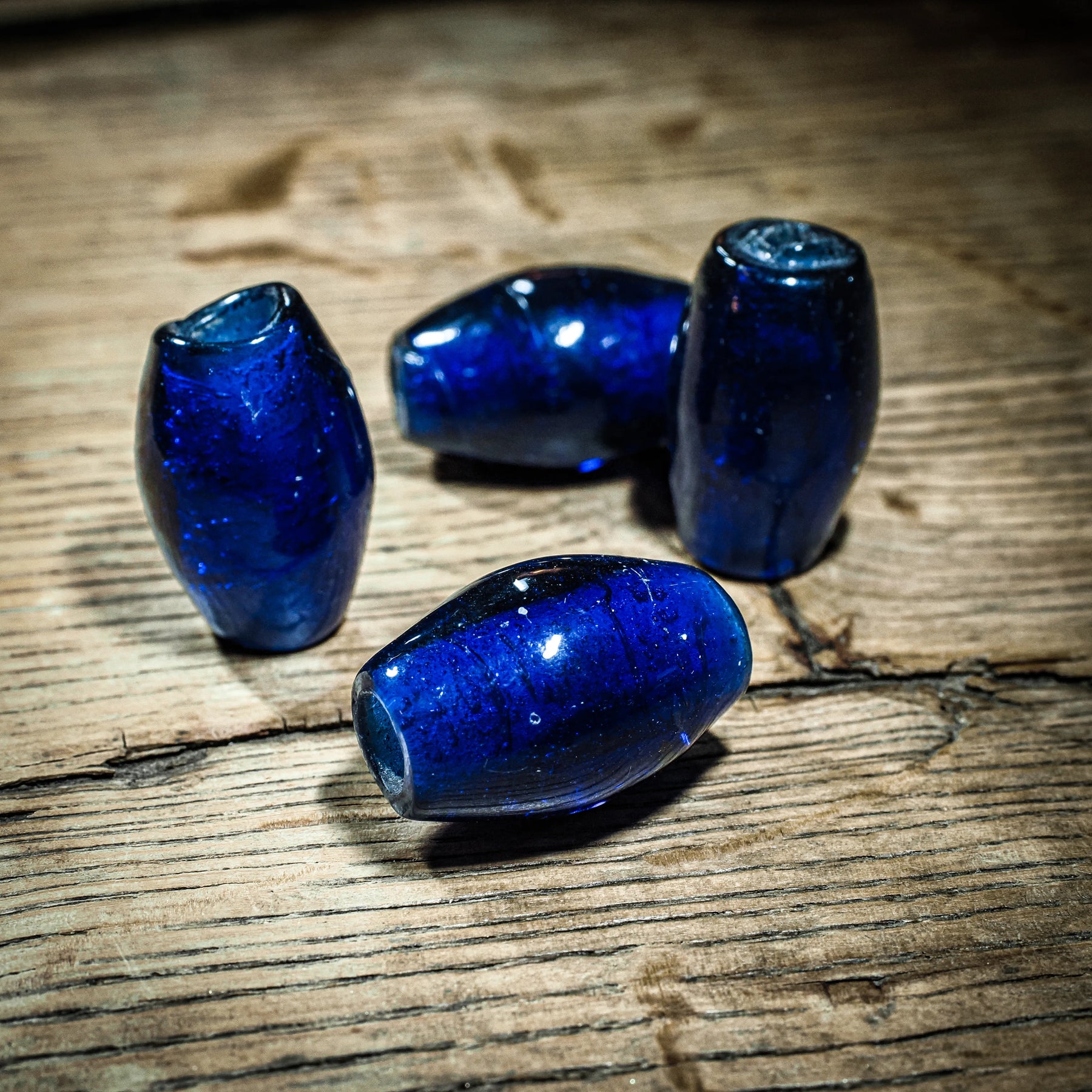 Deep blue bead in transparent glass, glossy – replica of a find on Gotland