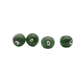 Green glass bead Birka – four beads in a row, white eyes with dark pupil and matt surface