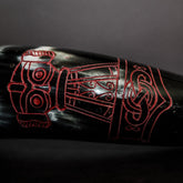 Drinking horn raven detail - close-up of brass raven with wings and spiral pattern in Nordic style