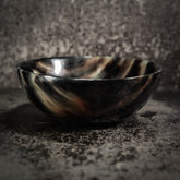 Natural oxhorn round bowl, 12cm diameter, with distinctive striped grain pattern and polished finish. Durable, compostable serving or decorative bowl