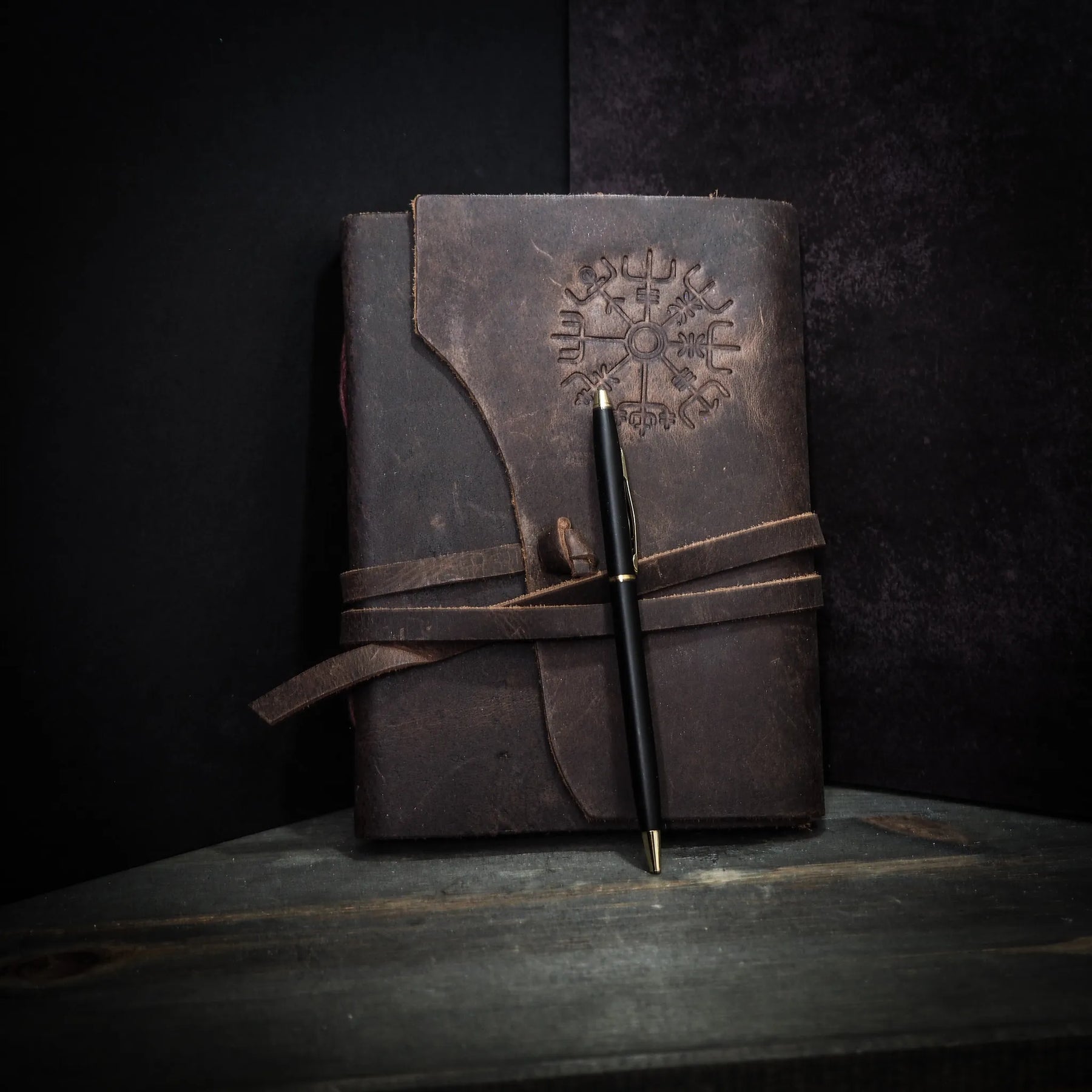 Medium leather notebook with embossed Vegvisir Norse spiritual compass symbol, dark brown leather with tie straps and brass details