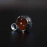 Gotlandshänge med röd karneol i silverpläterad mässingsinfattning med vikingatida gotländskt mönster och dekorativ ögla