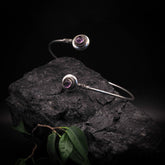 Adjustable upper arm ring with two black agate semi-precious stones in silver-plated brass bezel settings, decorative wire elements