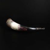 Drinking horn Eikthyrnir – another view of the horn in a stand with red-toned engraving