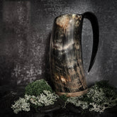 Large Thor beer mug, unpolished – dark mottled horn mug surrounded by green moss