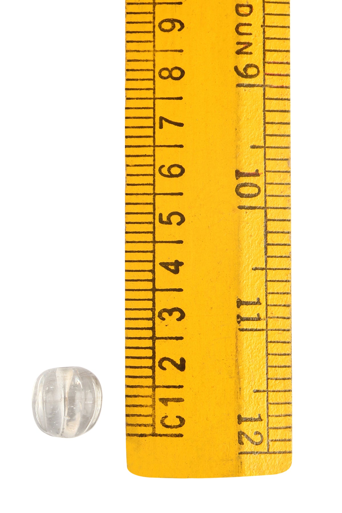 Transparent frosted glass bead (approximately 10mm) shown next to yellow metric ruler for size reference, displaying horizontal etched grooves across surface
