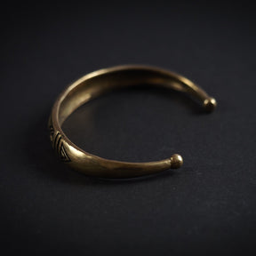 Open-cuff silver-plated stamped Viking bracelet with geometric X-cross and triangle patterns, with ball terminals