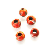 Röd rund glaspärla med dekor, Norge, med mönster guld.