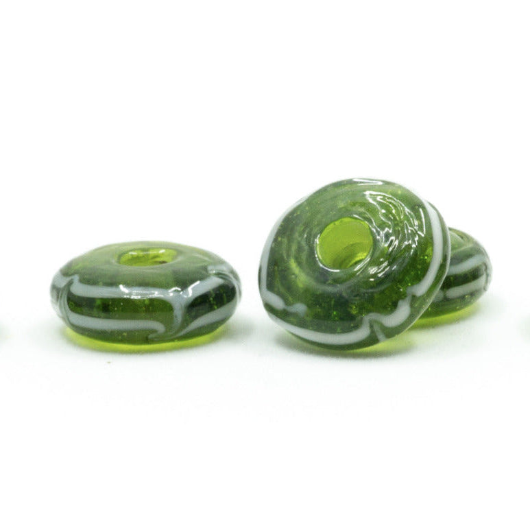 Green glossy glass bead with decor, Kaupang – five disc-shaped beads with white wave lines