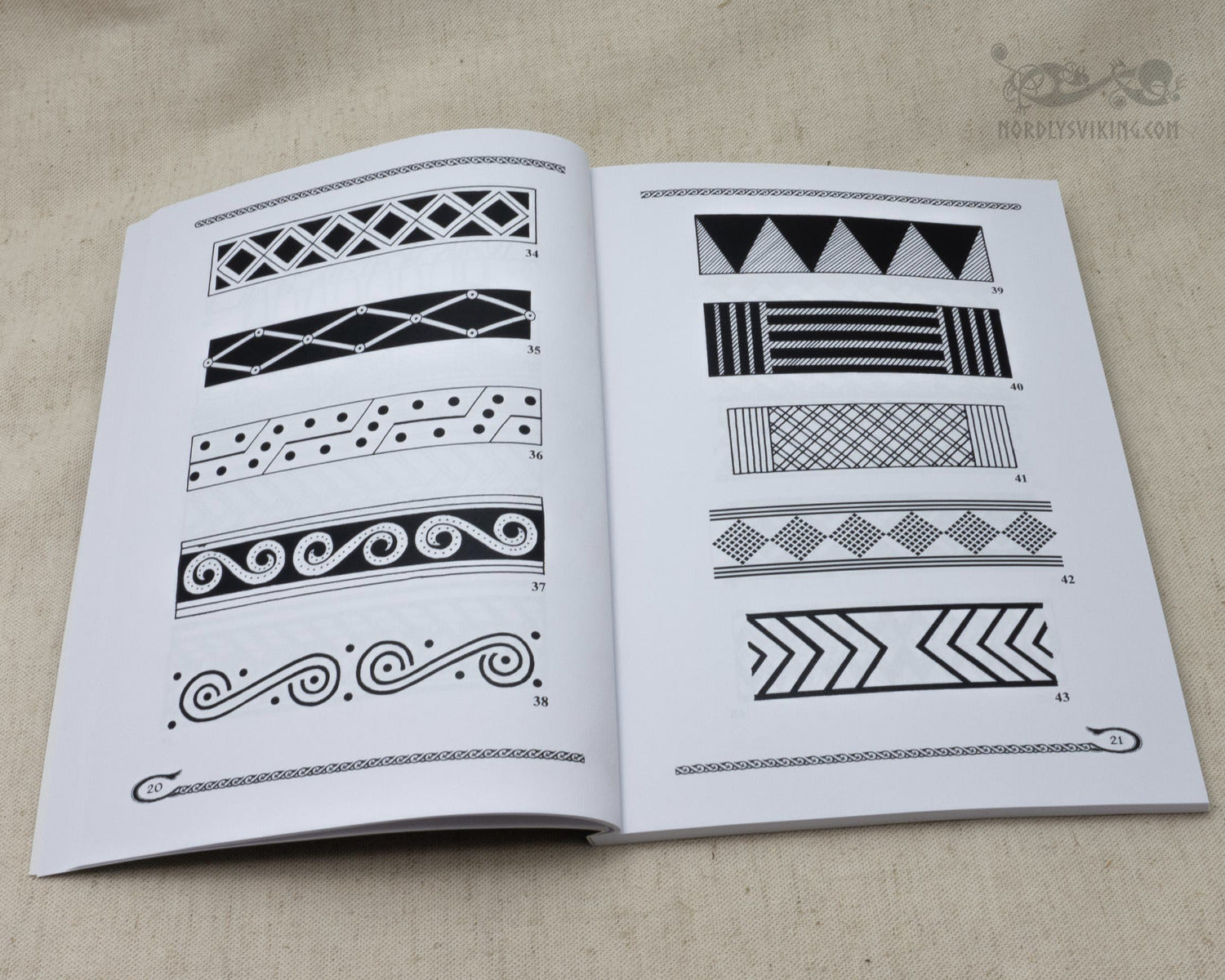Catalog page showing 12 numbered Viking and Slavic ornamental pattern designs including lattice, geometric, spiral, and chevron motifs