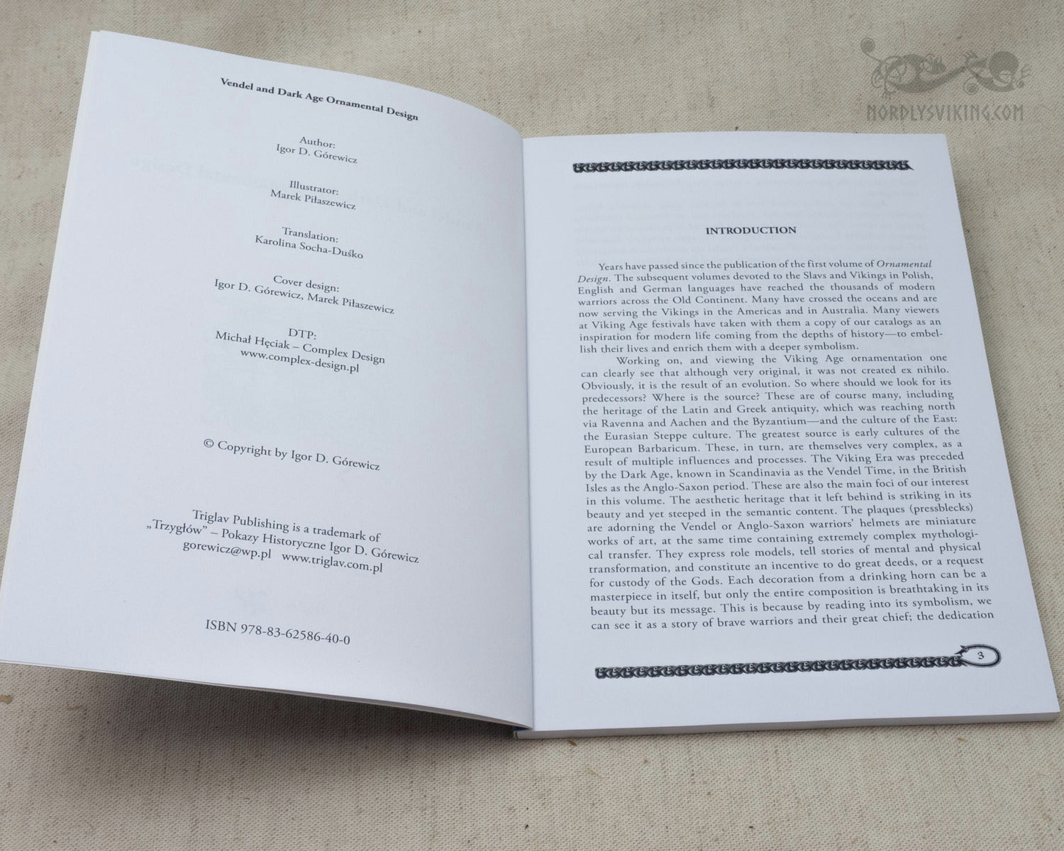 Book pages displaying Vendel and Dark Age animal-style ornamental patterns with interlocking creatures and serpent designs