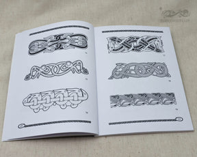 Book pages displaying Vendel-era ornamental border patterns with braided designs and geometric frames